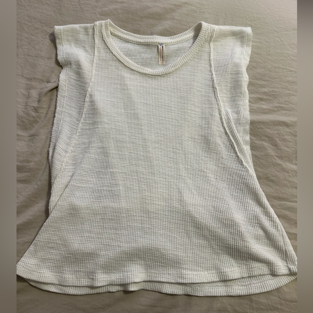NWOT. Free People Movement Size Small White Razor Back/ Muscle Tank.